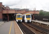 GWR details are everywhere at Birmingham Moor Street. Two Chiltern trains occupy the through lines under restored canopies and footbridge. 168002 on the left is heading for Snow Hill while 168108 is on a Marylebone service.<br><br>[Mark Bartlett 08/06/2011]