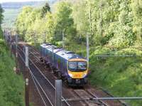 First TransPennine Express 1706 hrs service from Glasgow Central to <br>
Manchester Airport descending Beattock near to Auchen Castle on 30 May 2011. The M74 is nicely screened from view by the trees on right!<br>
<br><br>[John McIntyre 30/05/2011]