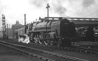A May evening at Polmadie shed in 1959. BR Standard 'Clan' Pacific no 72008 <I>Clan MacLeod</I> stands nearest the camera with tank locomotives 42144 and 80003 on the shed roads in the background. <br><br>[A Snapper (Courtesy Bruce McCartney) 16/05/1959]