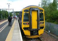A train for Queen Street waits at Anniesland bay platform 3 on 24 June formed by unit 158868.<br><br>[Veronica Clibbery 24/06/2011]