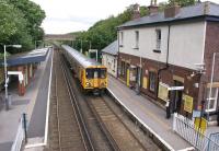 A Southport - Liverpool Central EMU arrives at Hightown station on the Merseyrail Northern line on Sunday afternoon 26 June 2011. Like many stations on Merseyrail, the booking office here is open on a Sunday.<br><br>[John McIntyre 26/06/2011]