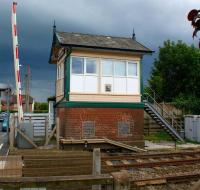 <I>'Looks like more rain on the way.'</I> Under a heavy sky on 6 July, Carleton Crossing signalbox stands alongside the line to Blackpool North. [Shortly after taking the photograph the heavens opened!]<br>
<br><br>[John McIntyre 06/07/2011]