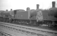 McIntosh 0-6-0T no 56332 stands out of use in the shed yard at Kingmoor in the summer of 1959, some 3 months prior to official withdrawal by BR.<br><br>[Robin Barbour Collection (Courtesy Bruce McCartney) 04/07/1959]