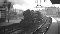 An ex-WD Austerity 2-8-0 runs tender first through Coatbridge Sunnyside in September 1961 heading for Kipps shed.<br><br>[K A Gray 25/09/1961]