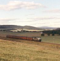 A Birmingham Type 2 slows for the Broomhill stop with a southbound Inverness-Forres-Perth train in 1961 [see image 26960]. <br><br>[Peter Oliver Collection (Courtesy David Spaven) //1961]