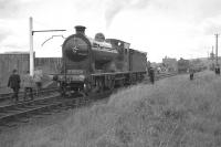 The RCTS (West Riding Branch) <I>'Borders Rail Tour'</I> at Greenlaw on 9 July 1961, having recently arrived from Hawick behind no 256 <I>Glen Douglas</I> and J37 no 64624. The locomotives are in the process of carrying out run round manoeuvres prior to making the trip back to St Boswells. Greenlaw station building stands in the right background with the road bridge just beyond.<br><br>[K A Gray 09/07/1961]