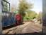 Looking out from the West Lancs running shed as <I>Irish Mail</I> departs with another service for Delph. Whilst steam is the main attraction on this line there is a fascinating collection of industrial narrow gauge diesels from a variety of systems. Photo with kind permission of WLLR volunteer staff. <br><br>[Mark Bartlett 25/04/2011]