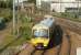 View east at West Ealing Junction on 4 June 2011. A Class 165 networker on a Greenford - Paddington service is about to leave the branch and join the main line before calling at West Ealing station in the background.<br><br>[John McIntyre 04/06/2011]