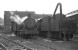 No let up in the rain at Sunderland South Dock on 27 May 1967, as now preserved Q6 0-8-0 No. 63395 [see image 25974] stands in steam outside the straight shed alongside WD 2-8-0 No. 90417. <br><br>[Bill Jamieson 27/05/1967]