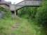 Looking north along down platform and trackbed at former Maesteg Station with complete footbridge only devoid of handrails still in situ.<br><br>[David Pesterfield 07/06/2011]