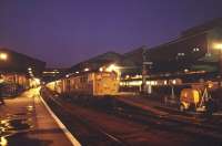 The 20.10 stopping train to Basingstoke about to leave Exeter St Davids on a November evening in 1983.<br><br>[Ian Dinmore 13/11/1983]