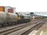 Freightliner 66605 waits at signals at the west end of Cardiff Central station on 8 June 2011. Once the section cleared the train took the Barry line - no doubt heading for Lafarge at Aberthaw - with cement / PFA tanks.<br><br>[David Pesterfield 08/06/2011]