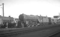 Old meets new at Carlisle Kingmoor on 26 March 1964, with Gresley V2 2-6-2 no 60864 standing alongside an unidentified EE Type 1 diesel locomotive. The V2 appears to have sustained collision damage at the front end and is recorded as being officially withdrawn by BR 10 days earlier. Its last shed allocation is shown as 50A York. The locomotive was disposed of through Darlington Works the following month.<br><br>[K A Gray 26/03/1964]