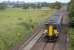 156 446 nears Breich with a stopping service (but not here) from Edinburgh to Glasgow Central on 21 July. In the background is the Five Sisters bing, a relic of the shale mining industry.<br>
<br><br>[Bill Roberton 21/07/2011]