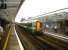 A train for London Victoria coasts into Chichester on 2 July 2011. An airy and well-kept station.<br><br>[Ken Strachan 02/07/2011]