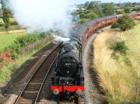 Working hard on the curving climb from Farington Curve Junction to Lostock Hall, 46115 <I>Scots Guardsman</I> approaches Coote Lane bridge on 27 July 2011 with the outward working of 'The Fellsman' from Lancaster to Carlisle.<br><br>[John McIntyre 27/07/2011]