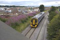 Fife-bound 158870 passes the site of the proposed tram/train interchange at Gogar on 1 August 2011.<br>
<br><br>[Bill Roberton 01/08/2011]