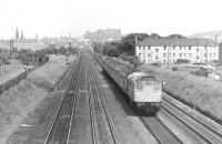 View east from Saughton Junction in 1975 as a push-pull train from Glasgow Queen Street powered by a class 27 locomotive at each end runs towards Haymarket West Junction. This view is no longer possible due to construction of the tram flyover [see image 34412].<br>
<br><br>[Bill Roberton //1975]