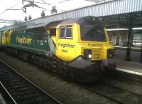 <I>Ahhh go on... give us a smile!</I> Freightliner 70.001 <I>'Power Haul'</I> shows off its curves as it heads South through Nuneaton station with containers on 15 July 2011.<br><br>[Ken Strachan 15/07/2011]