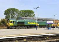 Freightliner 66606 with a PW train passing through Westbury station on 3 August heading towards London.<br><br>[Peter Todd 03/08/2011]