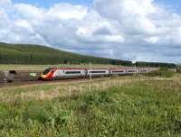 A southbound Pendolino passes a Freighliner coal train from <br>
Ravenstruther to Drax which has been looped at Beattock Summit on 30 May 2011. <br>
<br><br>[John McIntyre 30/05/2011]
