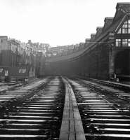 The carriage sidings on the west side of the Princes Street train shed were lifted not long before this winter 1965-66 shot was taken. The buildings to the left on Rutland Square survive to this day along with the distant Caledonian Hotel, not to mention the former station entrance itself [see image 8250]. <br>
<br><br>[David Spaven //1965]