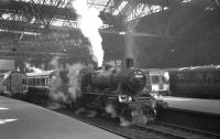 BR Standard class 2 2-6-0 no 78046 stands at Edinburgh's Princes Street station on 19 April 1965 at the head of the SLS/BLS <i>Scottish Rambler no 4</i> railtour. The locomotive took this section of the tour on a trip over the Balerno branch [see image 20499].<br><br>[K A Gray 19/04/1965]