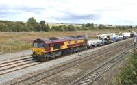 DBS 66116 heading west towards Didcot on 11 August 2011 in the process of restarting following a red signal. Note the 'heavy lift' Balfour Beatty crane in the consist.<br>
<br><br>[Peter Todd 11/08/2011]