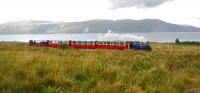 The 15.10 Torosay Castle Express heads south shortly after leaving Craignure. The view looks east across the Sound of Mull to Rubha an Ridire.<br><br>[Ewan Crawford 14/08/2011]