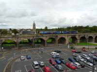 Class 156, 156501 runs over Kilmarnock Viaduct with 1E96, the 13.49 from Glasgow Central to Newcastle Central service. Photo taken from the rooftop of the adjacent multi-storey car park.<br><br>[Ken Browne 17/08/2011]