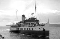 The worlds first diesel electric paddle vessel <I>Talisman</I> arriving at Largs from Millport on a Sunday in July 1966. Built for the London and North Eastern Railway in 1935 by  A & J Inglis (later builders of PS Waverley) at Pointhouse on the Clyde, she was withdrawn shortly after this picture was taken and eventually scrapped at Arnott Youngs, Dalmuir.  <br>
<br><br>[Colin Miller /07/1966]