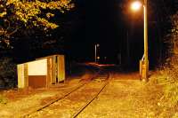Combe Junction illuminated at night in November 2009. The line to the left runs up to Liskeard and that to the right down to Looe.<br><br>[Ewan Crawford 18/11/2009]