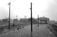 A desperately forlorn Dalry Road station and locomotive shed, looking west, in the winter of 1965-66. Nowadays the view to the left is dominated by Edinburgh's Western Approach Road, but miraculously the platform face on the right has survived adajacent to a public path which follows the solum for a short distance [see image 29494]. <br>
<br><br>[David Spaven //1966]