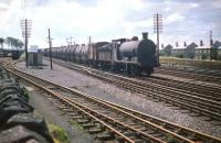 Polmont shed's J35 0-6-0 no 64531 brings a tank train east through Saughton Junction in July 1959. <br><br>[A Snapper (Courtesy Bruce McCartney) 18/07/1959]