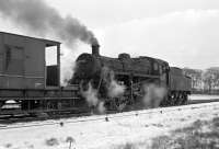 BR Standard Class 3 2-6-0 no 77002 shunts the goods yard at Duns on a snowy but bright 1st March 1965 while managing to stay on the rails. The turnout where both 61116 and D181 came unstuck is just off picture to the right. <br>
<br><br>[Bill Jamieson 01/03/1965]