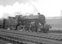 Crab 2-6-0 no 42737 at Beattock Summit on 29 March 1964 with <I>Scottish Rambler no 3</I>. The railtour was on its way to Beattock station where it would hand over to 80118 for a visit to the Moffat branch. [See image 21122]<br><br>[K A Gray 29/03/1964]