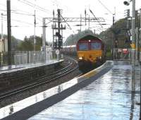 DBS 66221 with the early running 4J74 Cockenzie power station  - Hunterston import terminal, runs through Kilwinning station on 7 September in atrocious weather conditions!<br><br>[Ken Browne 07/09/2011]