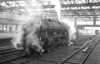 Shrouded in steam, Royal Scot 4-6-0 no 46152 <I>The King's Dragoon Guardsman</I> waits patiently on the centre road at Carlisle on 23 January 1965. The Scot had recently arrived from Kingmoor shed and was waiting to relieve the locomotive off the 9.25am Crewe - Perth train.<br><br>[K A Gray 23/01/1965]