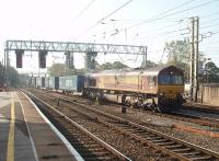 Substitute on the <I>Tesco Express</I>. Running around one hour late through Preston with the 4S43 Rugby to Mossend on 280911, DBS 66134 was presumably covering for a defective Class 92 electric. <br><br>[Mark Bartlett 28/09/2011]