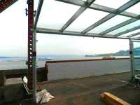 Looking out over the Clyde from Gourock station on 30 September showing a section of the new glazed canopies currently under construction.<br><br>[John Yellowlees 30/09/2011]