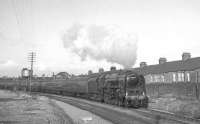 One of Tyne Dock's 9F 2-10-0s no 92097 passes Annfield Plain on 10 April 1965 with the RCTS (West Riding & NE branches) 'North Eastern No 2 Rail Tour'. [See image 37690]<br><br>[K A Gray 10/04/1965]