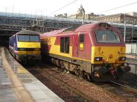 Come in number 19. No not you, that wayward one on the right. 67019 with wheel chocks in place stands alongside ScotRail liveried 90019 in Edinburgh Waverley's east end loco stabling bay. It was later noted stabled on Craigentinny Depot in the early evening. <br><br>[David Pesterfield 04/10/2011]