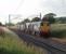 A rare sight these days and very welcome on a fine summer evening in July 2011. DRS 20308 and 20309 head the 6K73 Sellafield to Crewe flasks south along the WCML. 20309 emerged from Robert Stephenson Hawthorn works as D8075 in the summer of 1961 and so has just celebrated its fiftieth birthday. 20308, as D8187, was from the later <I>post Clayton</I> batch built at Vulcan Foundry in 1967. The distinctive EE whistle from their engines' exhausts as they ambled past evoked many memories.  <br><br>[Mark Bartlett 27/07/2011]