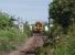 The Kessock Bridge almost frames 158720, as it negotiates the 10mph Clachnaharry swing bridge while heading west on a Kyle line service on 1 July 2011. This view was taken from the beer garden of the Clachnaharry Inn at the site of the long closed station. <br><br>[Mark Bartlett 01/07/2011]