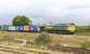 Freightliner 66518 brings a container train round the north to east curve between Oxford and Didcot on 11 August 2011.<br><br>[Peter Todd 11/08/2011]