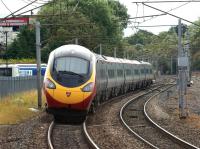 Having just passed through Penrith, a southbound Pendolino is about to cross the M6 motorway at junction 40 on 10 September 2011. To the right is the present day Down Slow line which used to continue west from the WCML towards Keswick and Cockermouth [see image 21956].<br>
<br><br>[John McIntyre 10/09/2011]