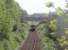 The view east towards Castle Kennedy from the small overbridge near Stranraer Town as 156449 heads for the port. The building on the right was formerly part of the rail freight handling facilities at this location. [See image 34207] for the view west from the same bridge.<br><br>[Mark Bartlett 23/05/2011]