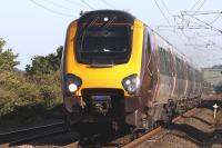 221132 on a Northbound CrossCountry service approaching West Goswick Farm level crossing, Northumberland, in July 2011.<br><br>[Graham Morgan 27/07/2011]