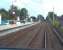 Photograph taken from the rear of a Metro service departing from Fawdon for Newcastle Airport on 10 September 2011. The train has just left from the staggered platform on the far side of the level crossing - the Newcastle bound platform stands on left. [See image 21036]<br><br>[Andrew Wilson 10/09/2011]