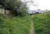 Remains at Lochmaben in May 2008 looking south east towards Lockerbie. The station closed in 1952, although the line survived until 1966. The white cottage in the centre was built on the old trackbed. The station platforms were once crossed by a road bridge located just beyond the cottages carrying the B7020. The bridge was demolished and the road rerouted slightly to the west following closure. [With thanks to Alan Hannah]. [See image 35752]. <br><br>[John Furnevel 20/05/2008]